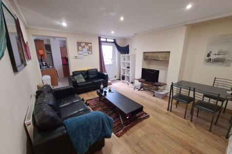 A bright and welcoming living room featuring a ...