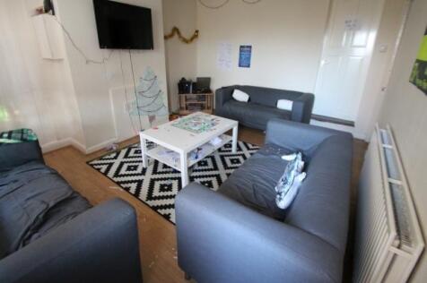 A spacious and well-maintained living room feat...