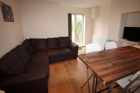 A well-lit, inviting living room featuring a la...