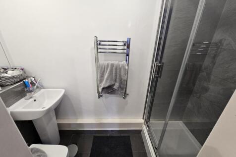 A clean and well-maintained bathroom with a sho...