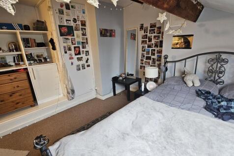 A spacious and well-maintained master bedroom f...