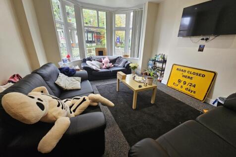 Bright and welcoming living room featuring comf...