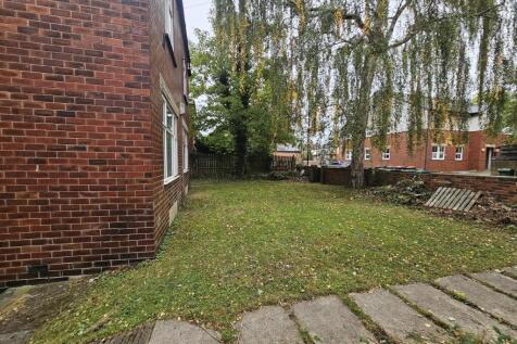 A welcoming view of the front yard showcasing a...