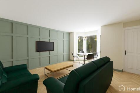 Modern and inviting living room featuring a sty...