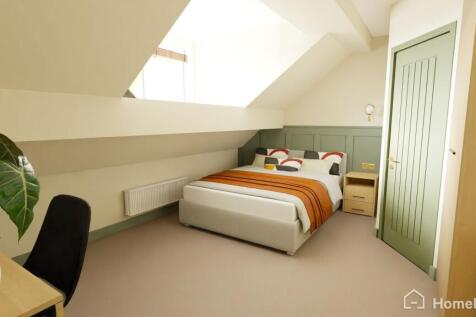 Bright and stylish bedroom with a comfortable d...
