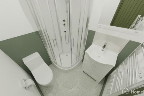 Modern compact bathroom featuring a corner show...