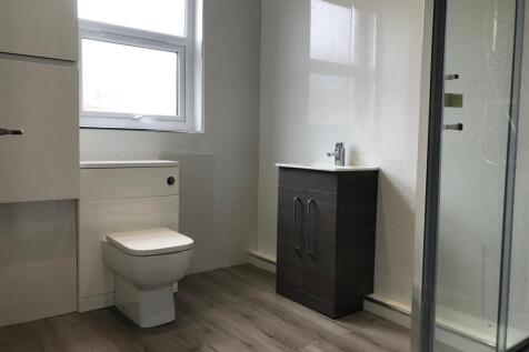 A clean and well-maintained bathroom featuring ...
