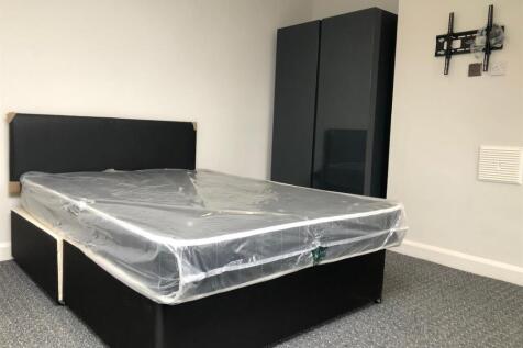 A neatly presented single bedroom featuring a c...