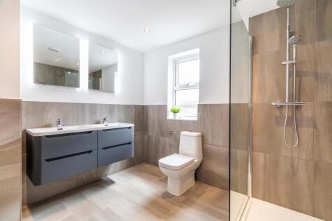 Modern and well-maintained bathroom featuring a...