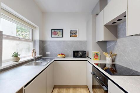 Modern and bright kitchen with ample natural li...