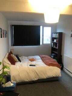 Bright, comfortable double bedroom with a neatl...