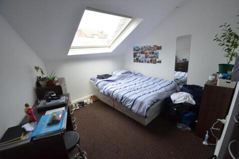Bright attic double bedroom with a skylight, do...