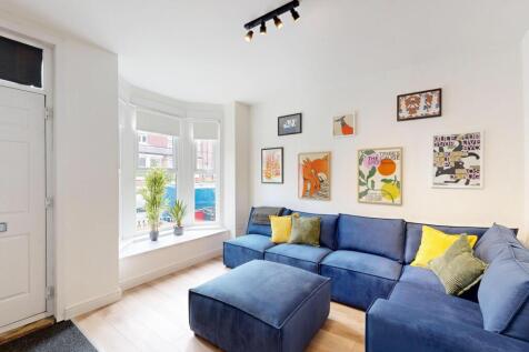 Bright and welcoming living room featuring a la...