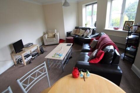A bright and welcoming living room featuring co...