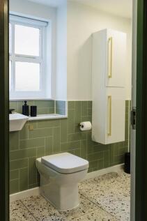 Bright and clean bathroom featuring a modern to...