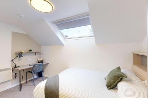 Bright, attic-style double bedroom with a comfy...