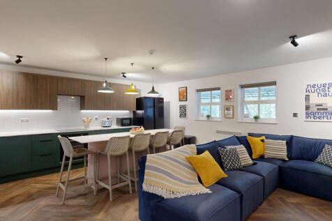 Spacious open-plan living area with a large com...