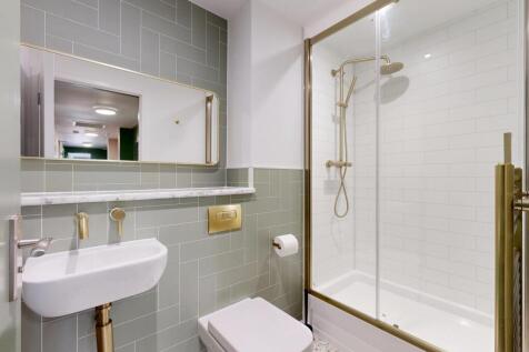 Contemporary bathroom with a walk-in glass show...