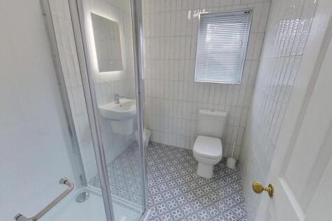 A clean, well-maintained bathroom featuring a S...