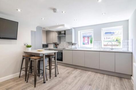 Modern and bright kitchen with ample counter sp...