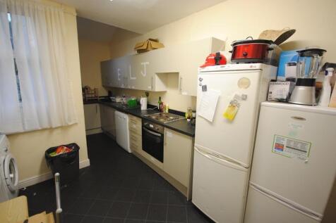 A functional kitchen area with basic appliances...