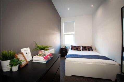 Bright and neatly maintained master bedroom fea...