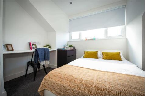 Bright and inviting master bedroom featuring a ...