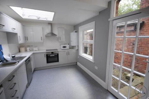 Bright and modern kitchen with ample natural li...