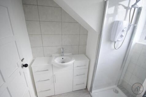 A clean and bright bathroom featuring a washing...