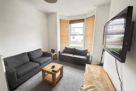 Bright, modern living room with two comfortable...