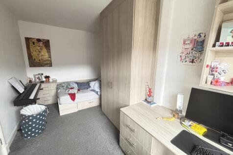 Neat, well-lit bedroom with built-in wardrobe, ...