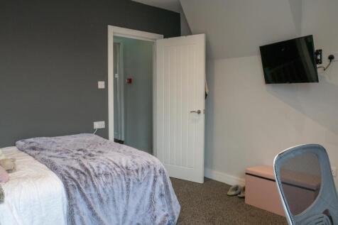 Bright and well-maintained bedroom featuring a ...