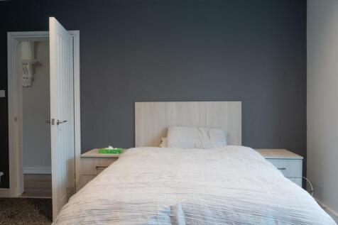 A spacious and well-maintained master bedroom f...