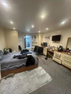 Spacious and inviting living room featuring mod...