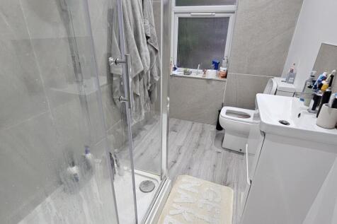 A modern, well-maintained bathroom featuring a ...