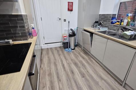 Modern and clean kitchen area with ample counte...