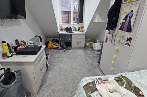 A cozy living room featuring a window that allo...