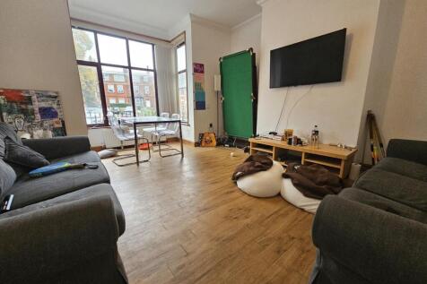 A spacious and inviting living room with large ...