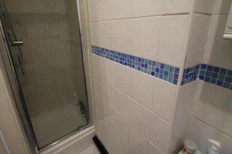 A clean and well-maintained bathroom featuring ...