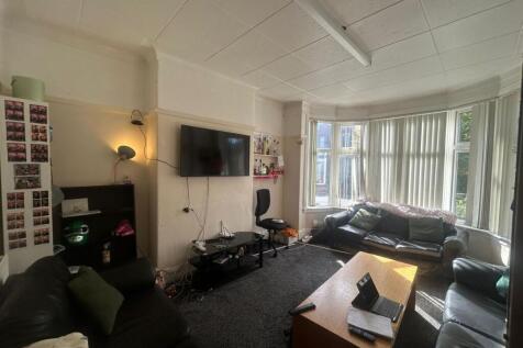 A spacious and inviting living room with large ...