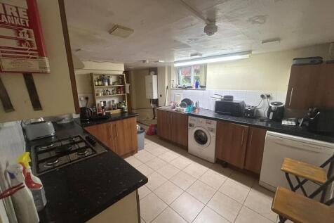 A well-lit, modern kitchen with ample workspace...