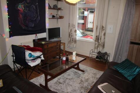 Cosy furnished living room with wood floors, a ...