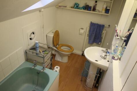 Bright upstairs bathroom with a separate bathtu...