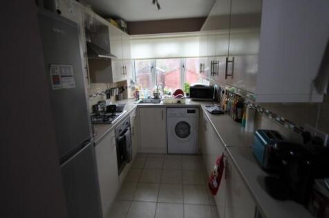 A bright and well-maintained kitchen with ample...