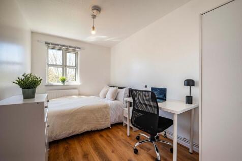 Bright and inviting double bedroom with natural...