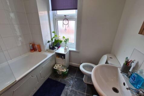 Bright and modern bathroom featuring a clean wh...