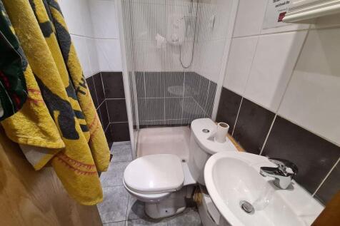 A modern bathroom featuring a clean white sink ...