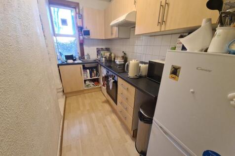 A well-maintained kitchen area featuring essent...