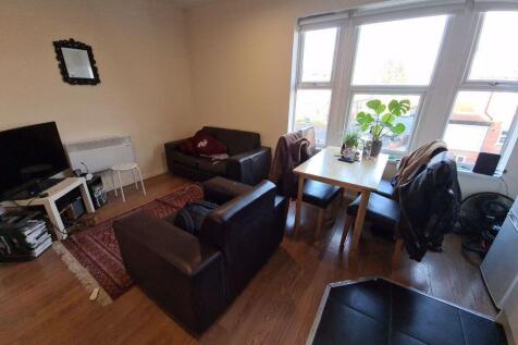 A bright and inviting living room with large wi...