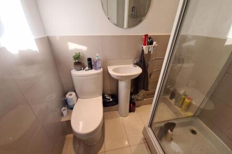 A clean and well-maintained bathroom with a toi...